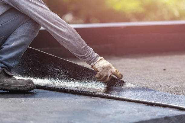 Professional Basement Waterproofing technician working in Rogers, TX